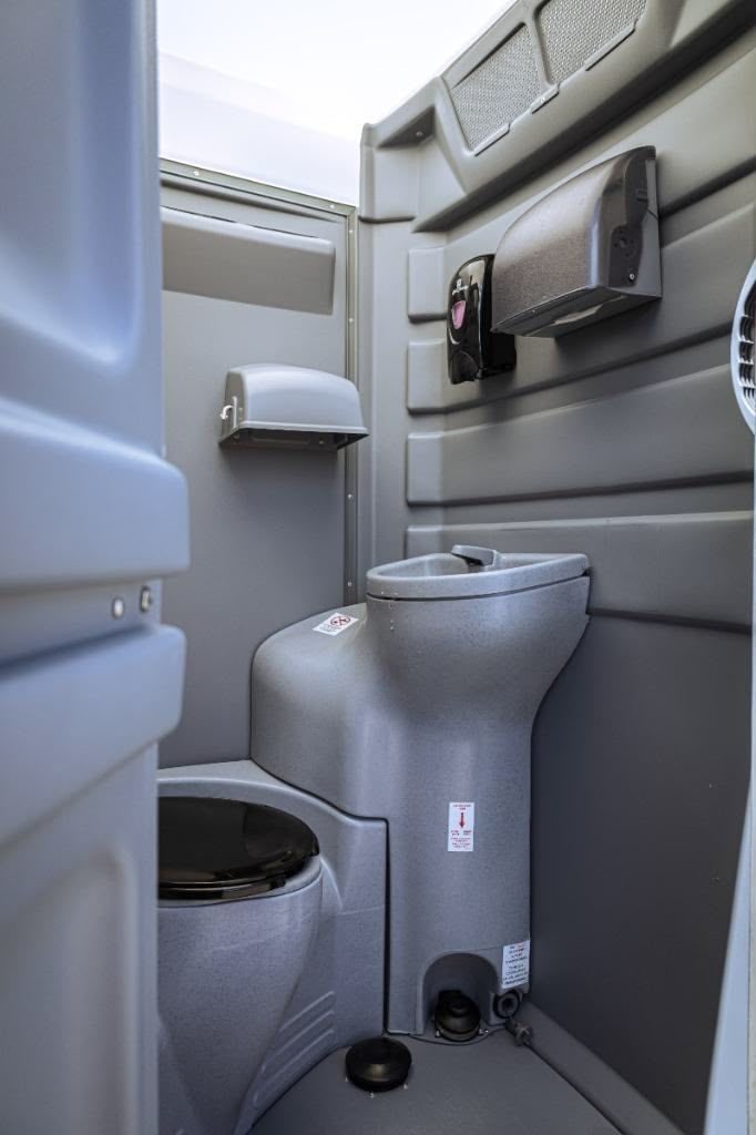Deluxe restroom unit set up near event tents