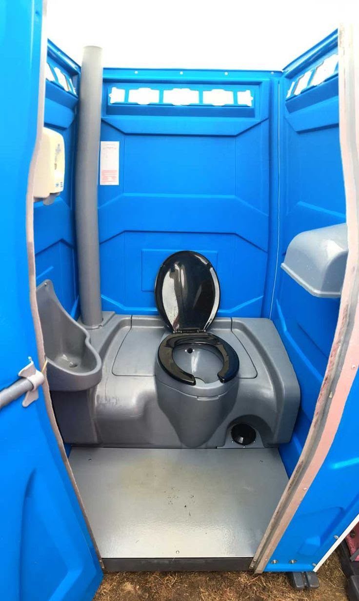 RV bathroom interior and delivery crew servicing a remote unit